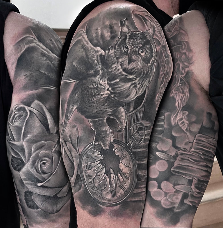 Realistic black and gray owl with a pocket watch and roses half sleeve tattoo.