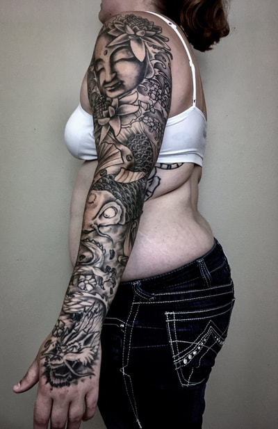 Blank and gray Japanese sleeve with a koi fish, dragon, Buddha, and cherry blossoms.