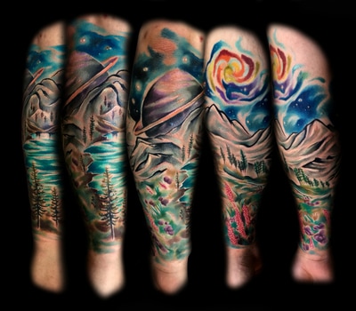 Space and mountain scene tattoo leg sleeve in color surrealism.
