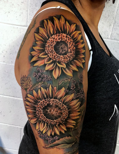Realistic colorful sunflowers with a blue background half sleeve.